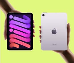An iPad Mini in a person's hand.