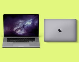 Two MacBook Pros open and closed alongside each other